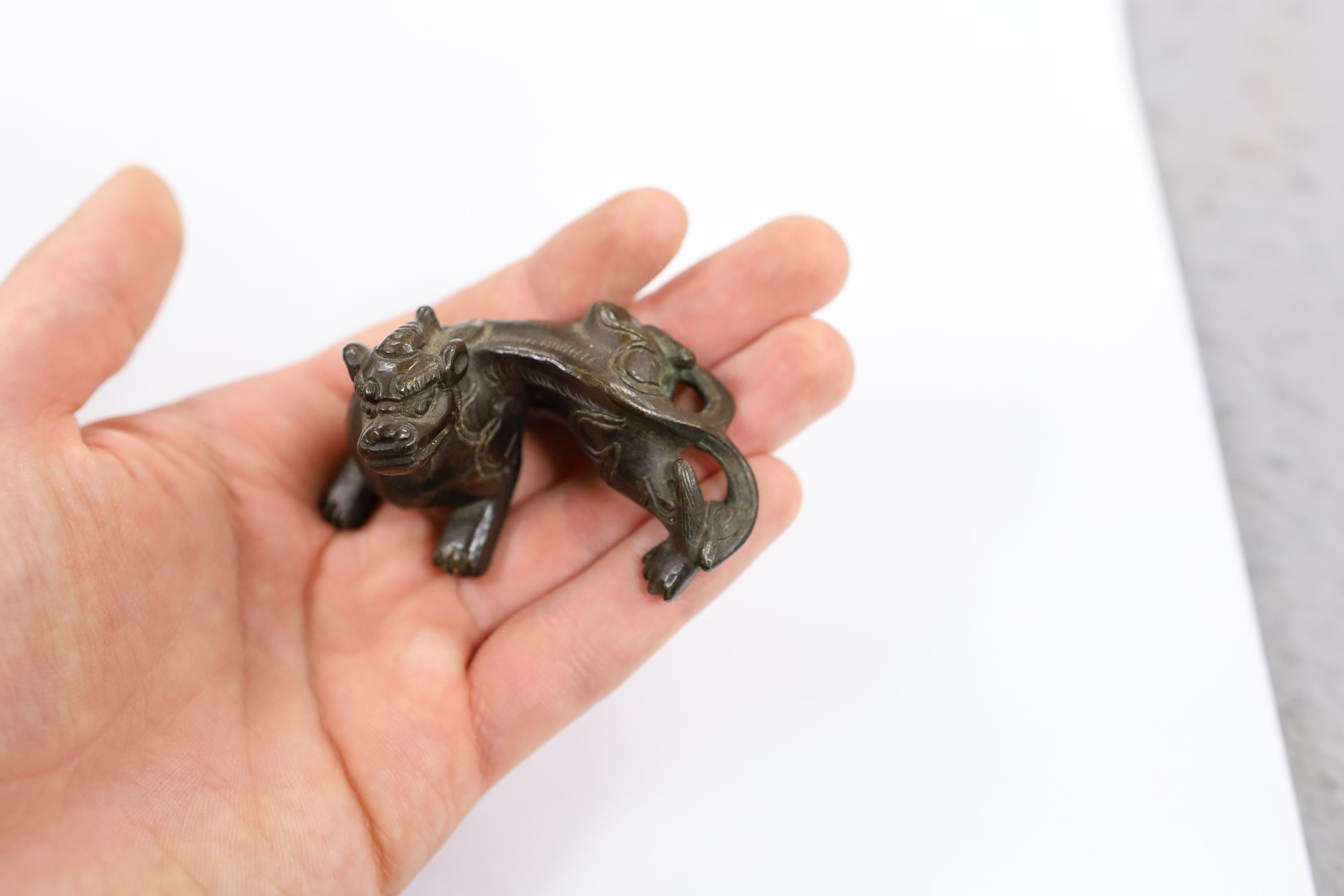 Five Chinese or Tibetan bronze figures or Buddhist implements, tallest 13cms high